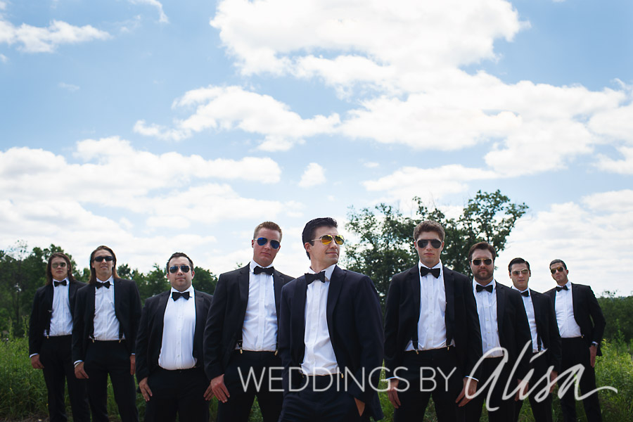 Groom and his groomsmen pose for portraits